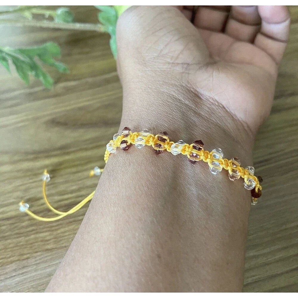 Yellow women's bracelet braided with crystals